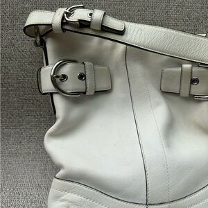 Vintage Coach oyster white leather and Kate Spade navy nylon zipper top bags.